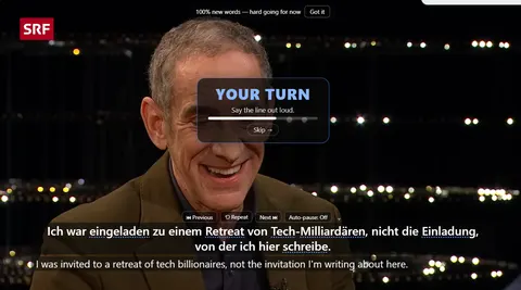 A paused video with a panel reading YOUR TURN, Say the line out loud, a countdown bar and a Skip button.