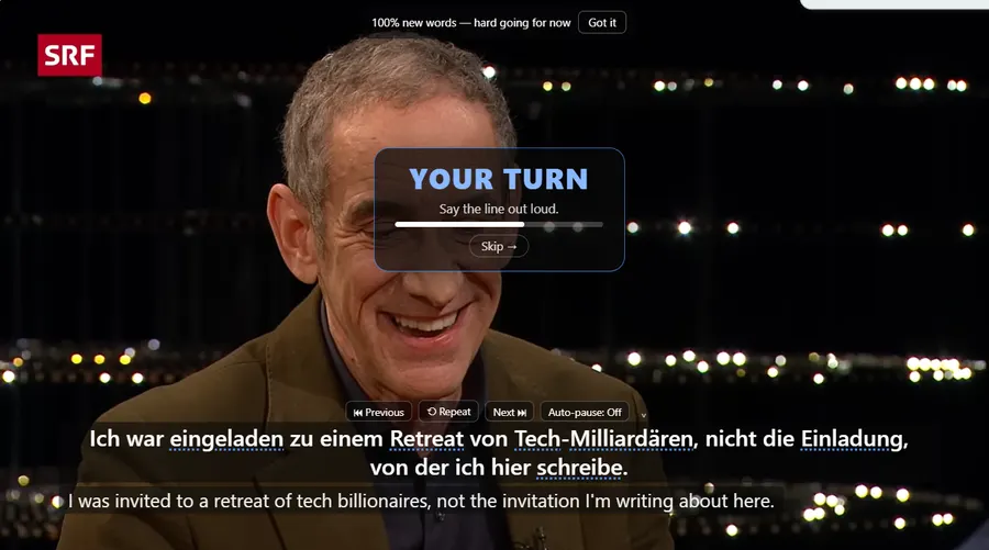 A paused video with a panel reading YOUR TURN, Say the line out loud, a countdown bar and a Skip button.